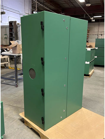 A free standing NEMA electrical enclosure finished in green