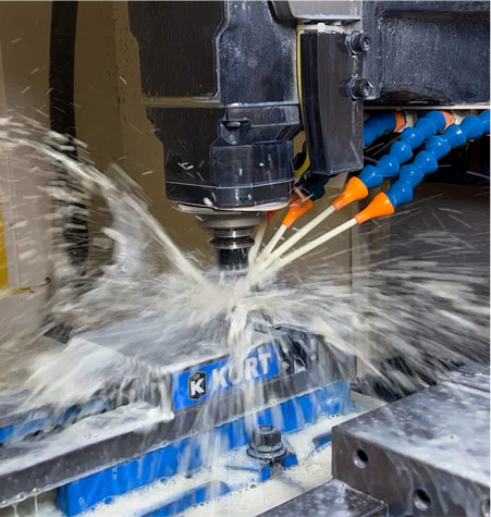 A CNC Mill milling a piece of metal in our Amesbury MA facility