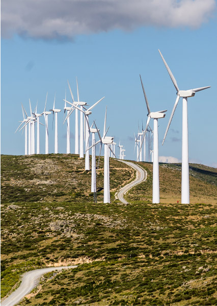 A wind farm on a hillside generating green energy